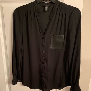Cute black shirt with leather pocket and buttons.